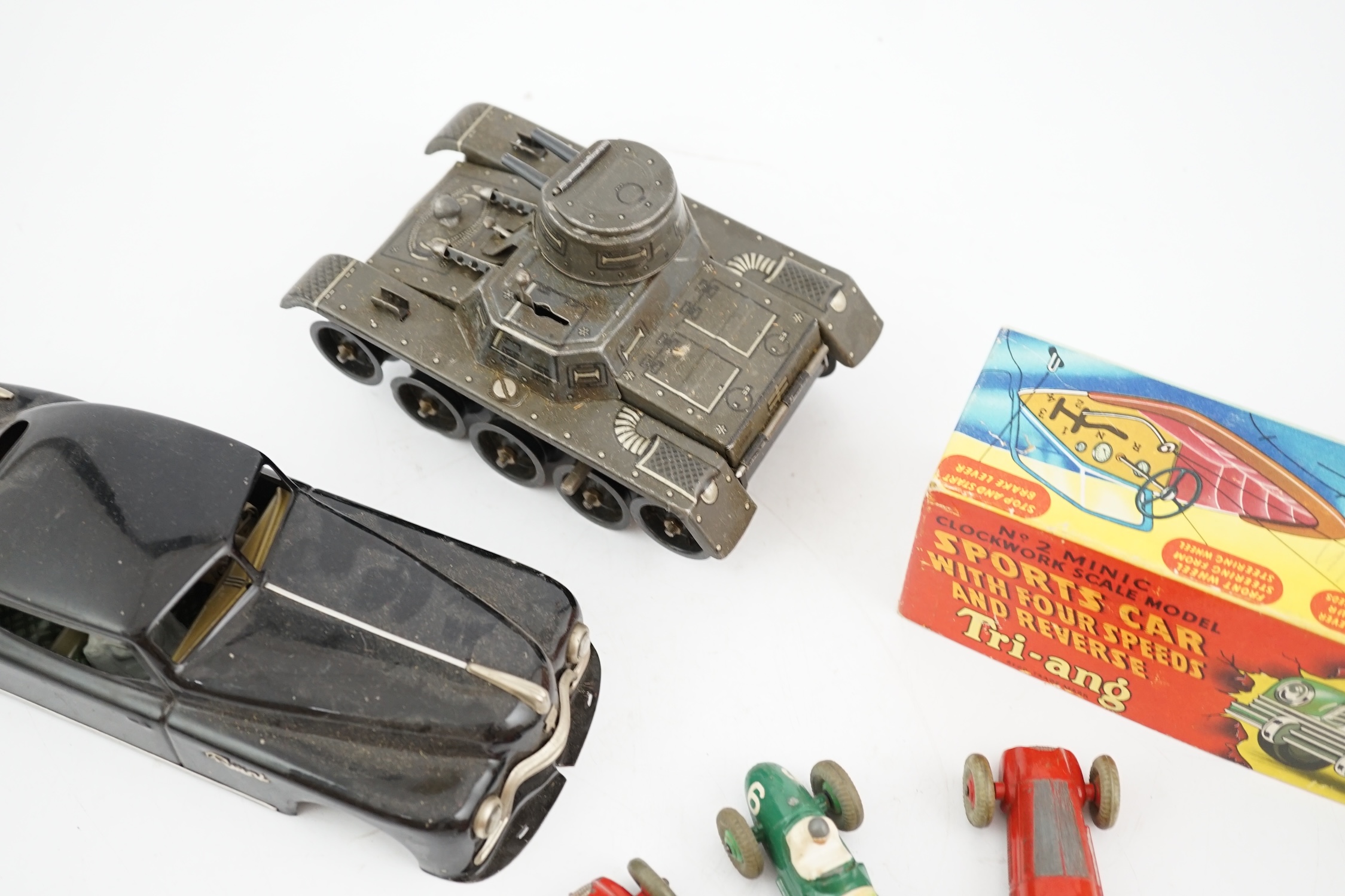 Eleven tinplate and diecast vehicles by Dinky Toys, Tri-ang, Gama, etc., including a Primal Arnold tinplate remote controlled car, a Tri-ang Minic Sports car with four speeds, a Gama Montage Tank, a Tri-ang Minic Armoure